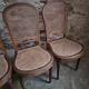 Set of 6 antique Louis XVI style dining chairs with caning.