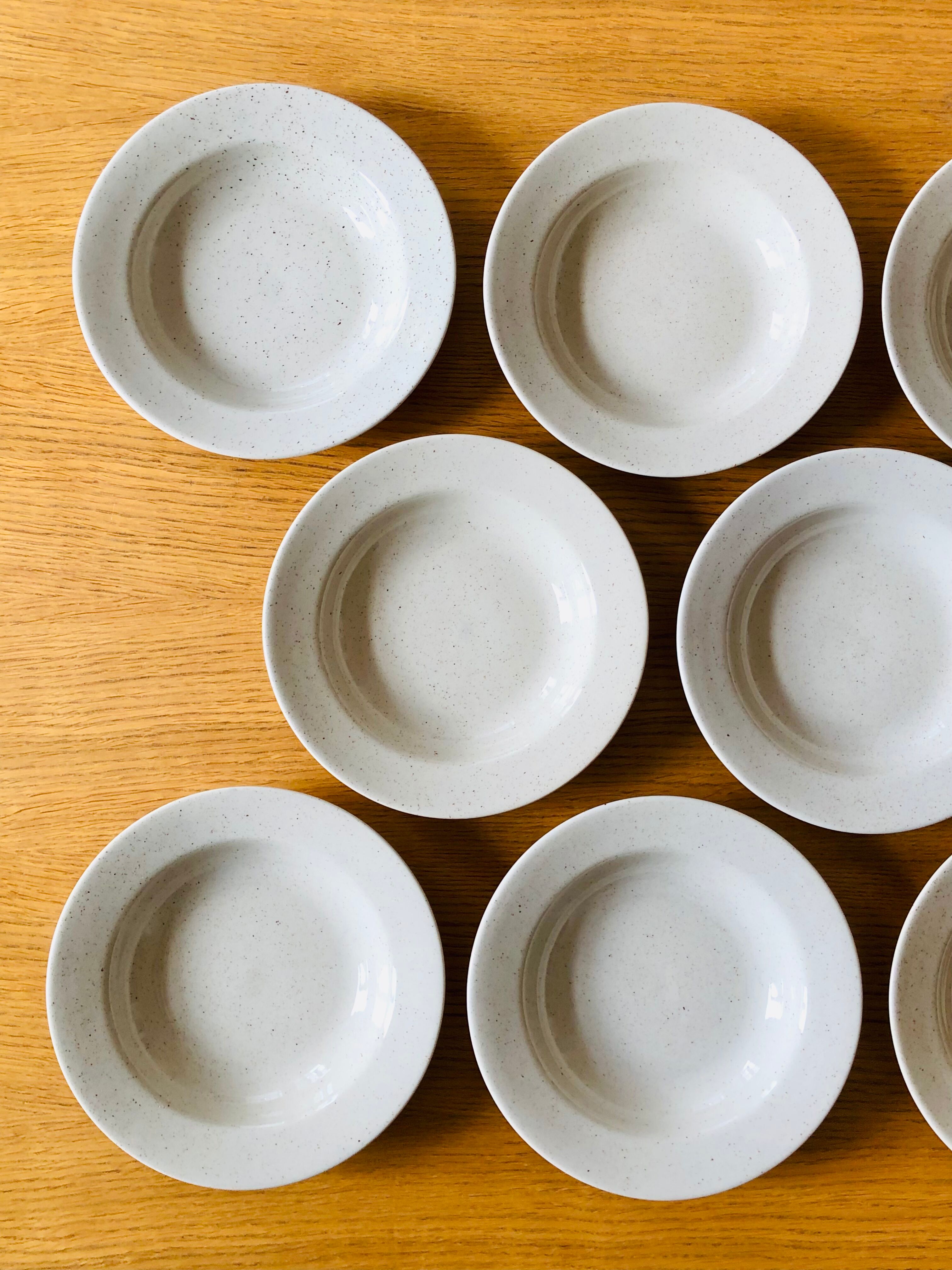 Set of 8 hollow plates in speckled ceramic