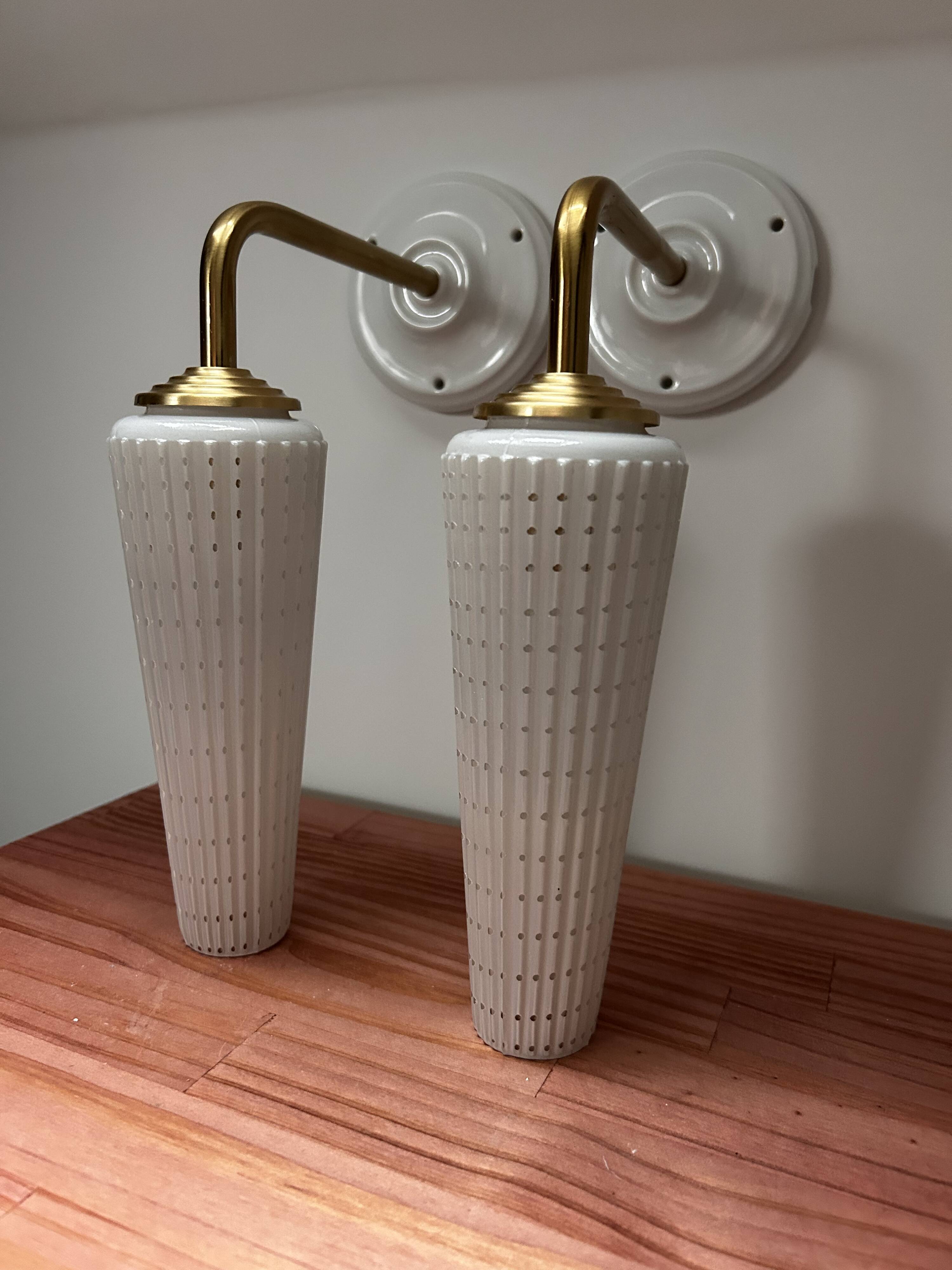 Pair of white and gold wall sconces