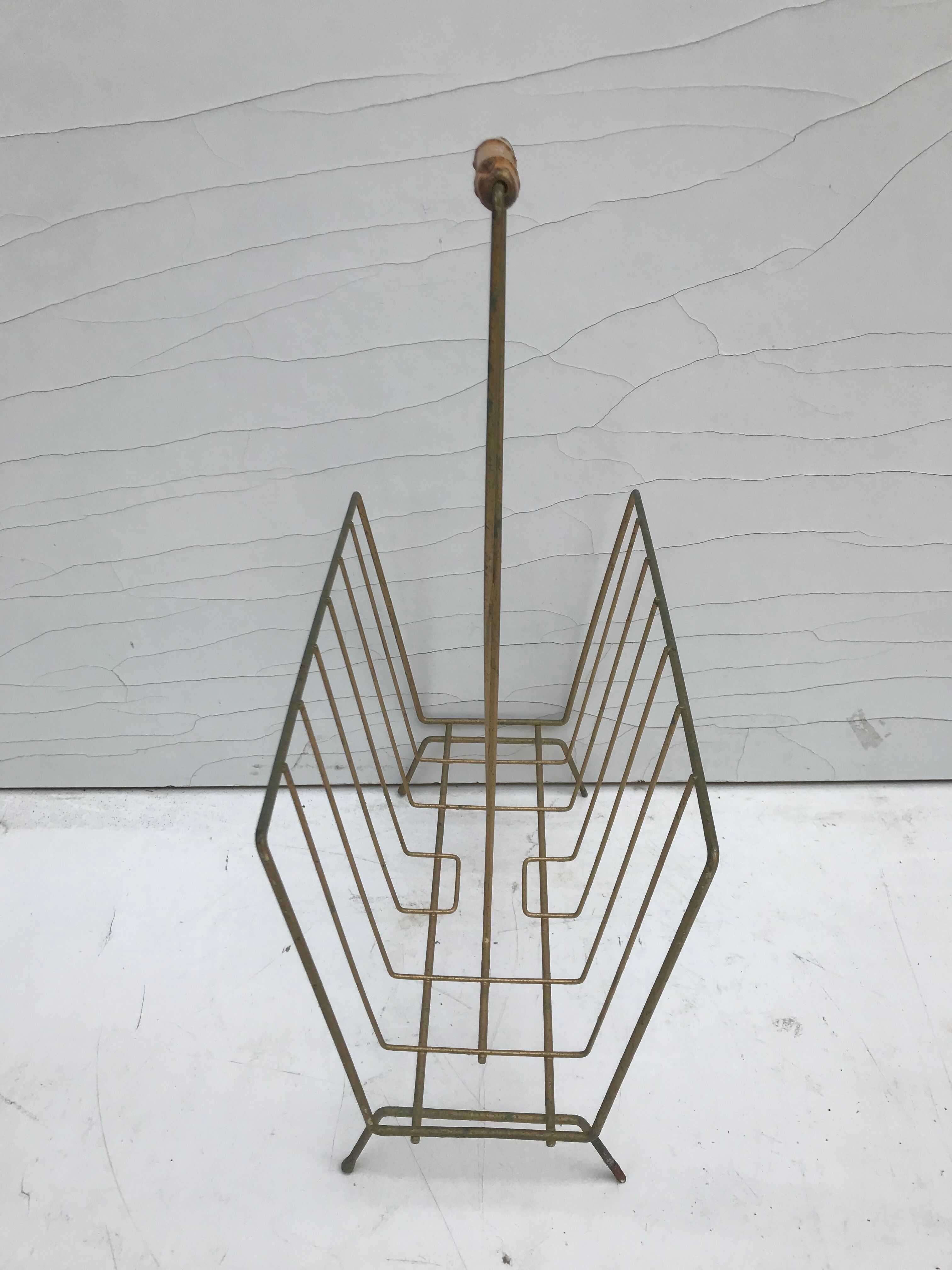 Magazine holder in golden metal and its handle is in bamboo, 1960 vintage