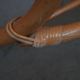 Vintage rocking chair in rattan from the 60s-70s, high openwork backrest.