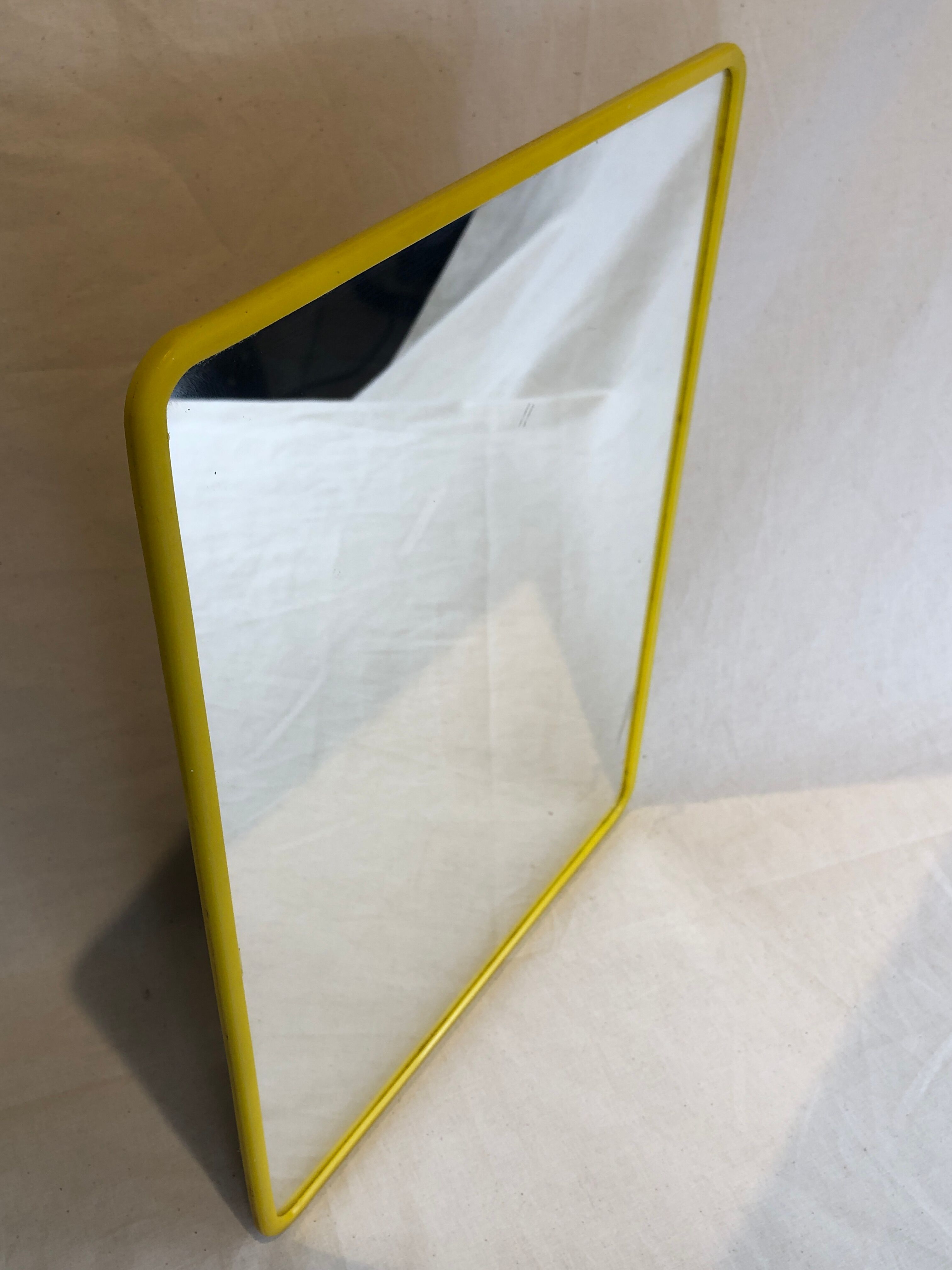 1970s mirror yellow plastic frame