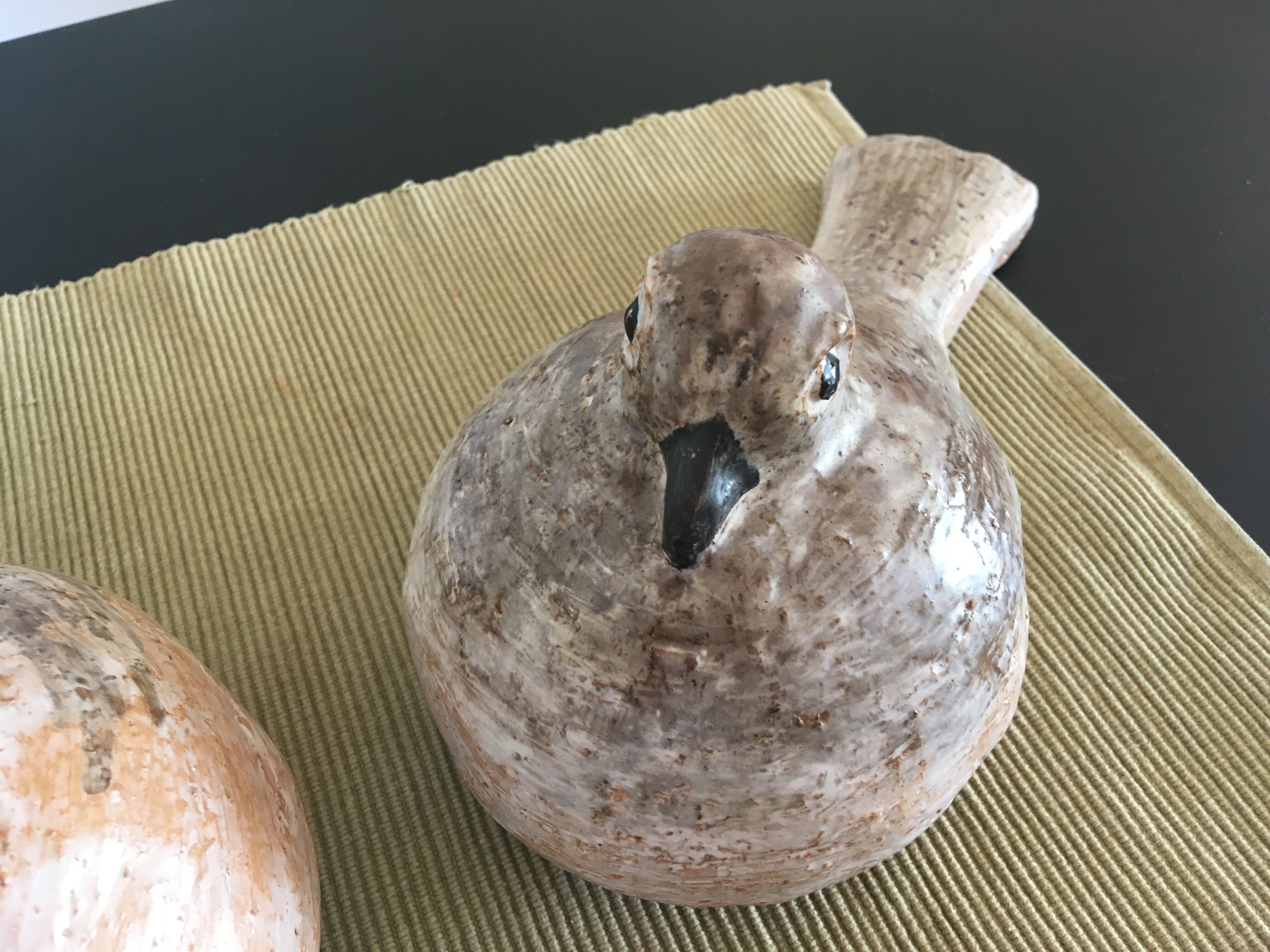Pairs of birds in ceramic signed
