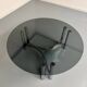 Round coffee table in smoked glass and chrome steel, 1970s design.