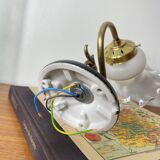 Swan neck wall light in brass with glass tulip.