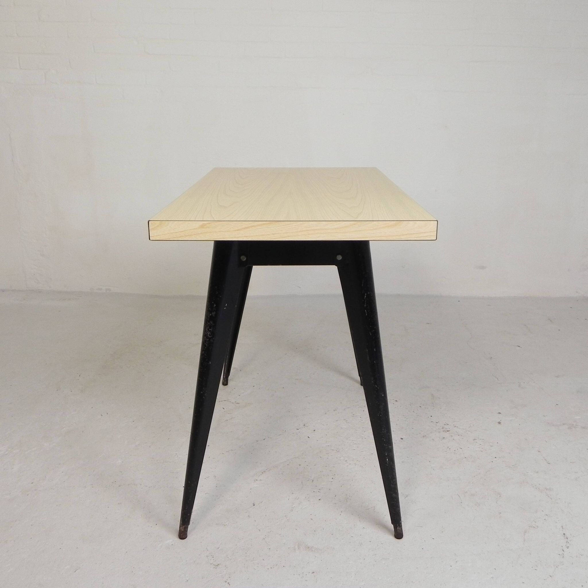 Bistro table Henri Julien, model Tolix T55 with a Formica top, 1950s.