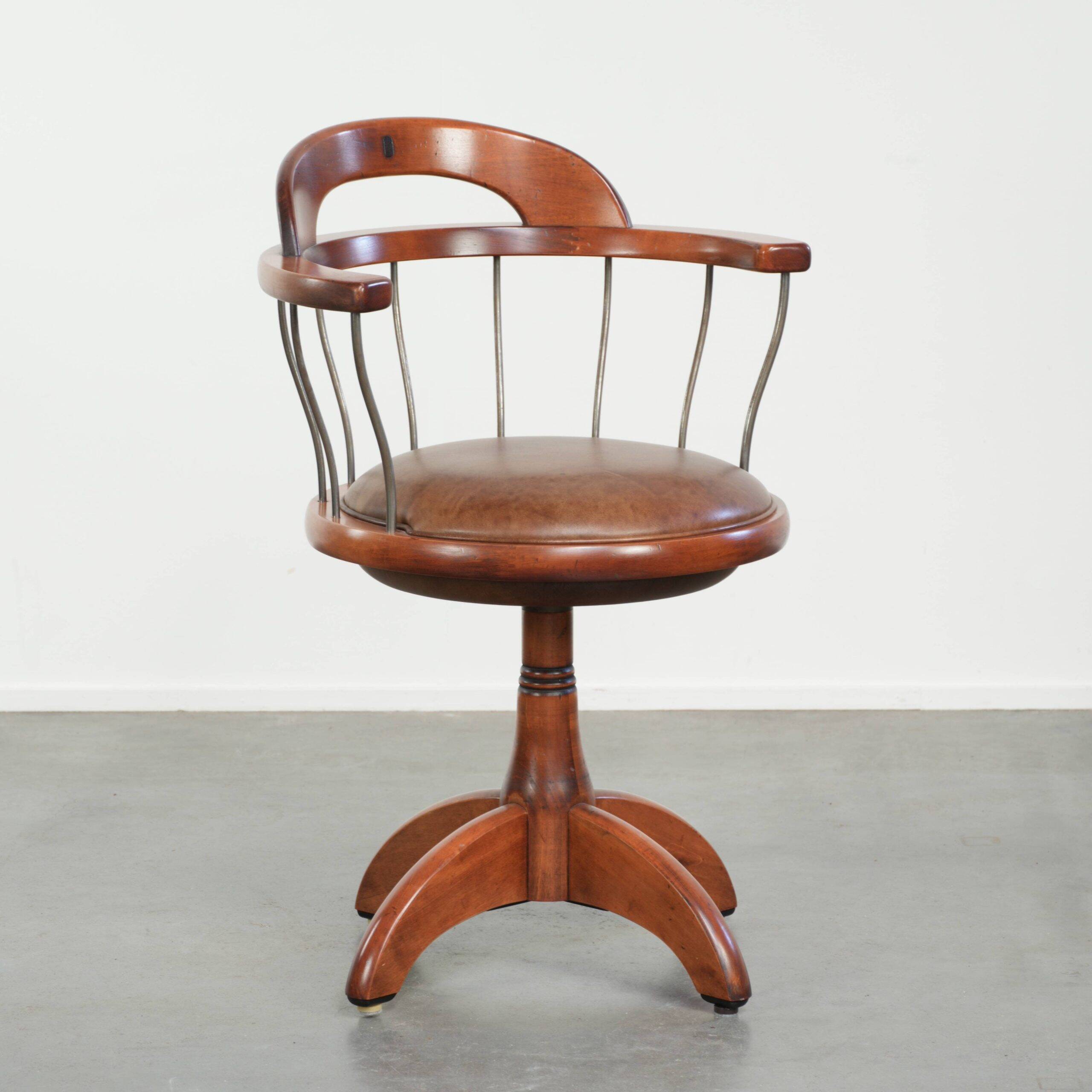 Swivel side chair / office chair with a cognac-coloured cow leather seat