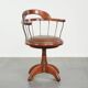 Swivel side chair / office chair with a cognac-coloured cow leather seat