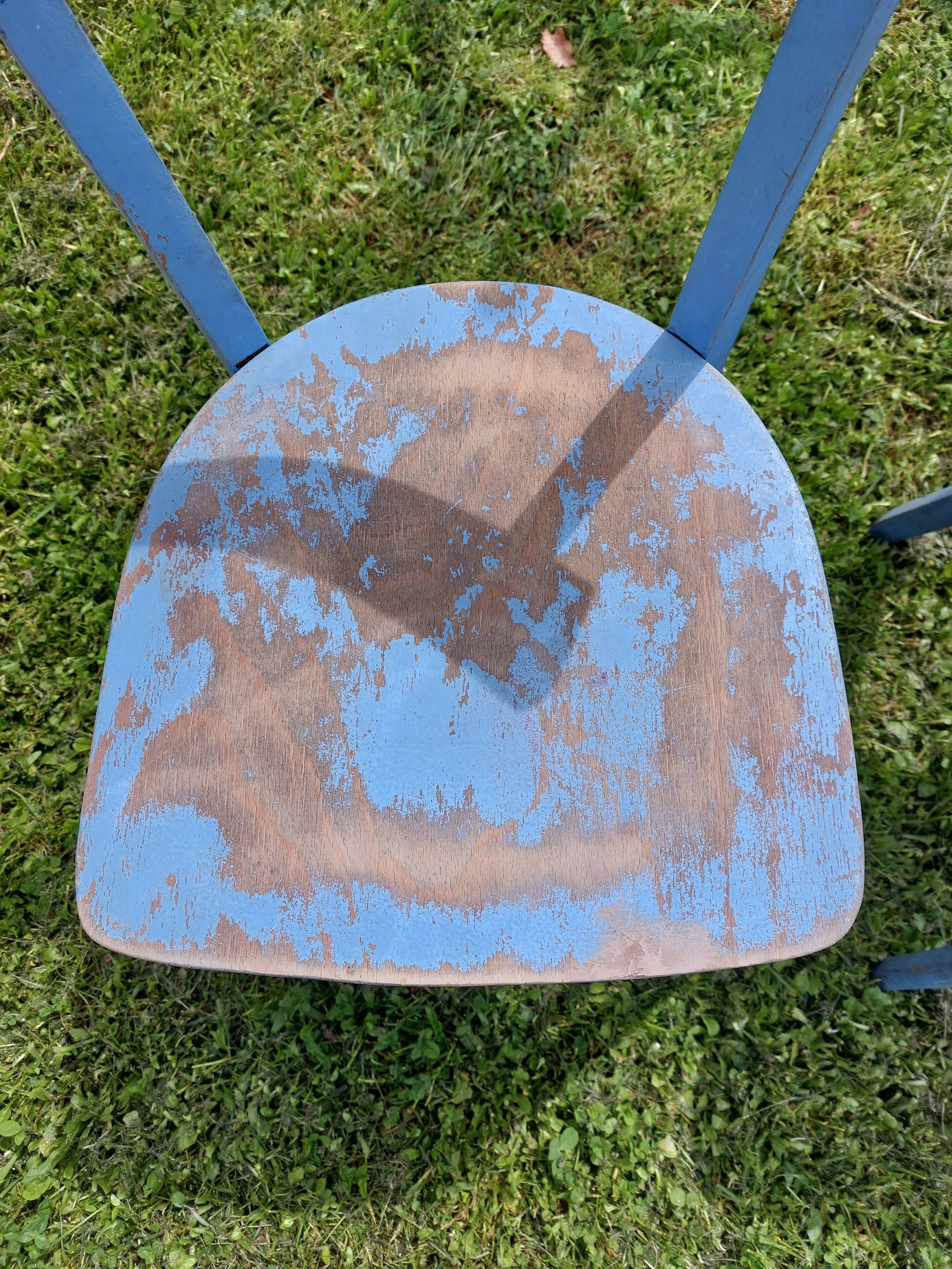 pair of chippy blue paint bistro chairs