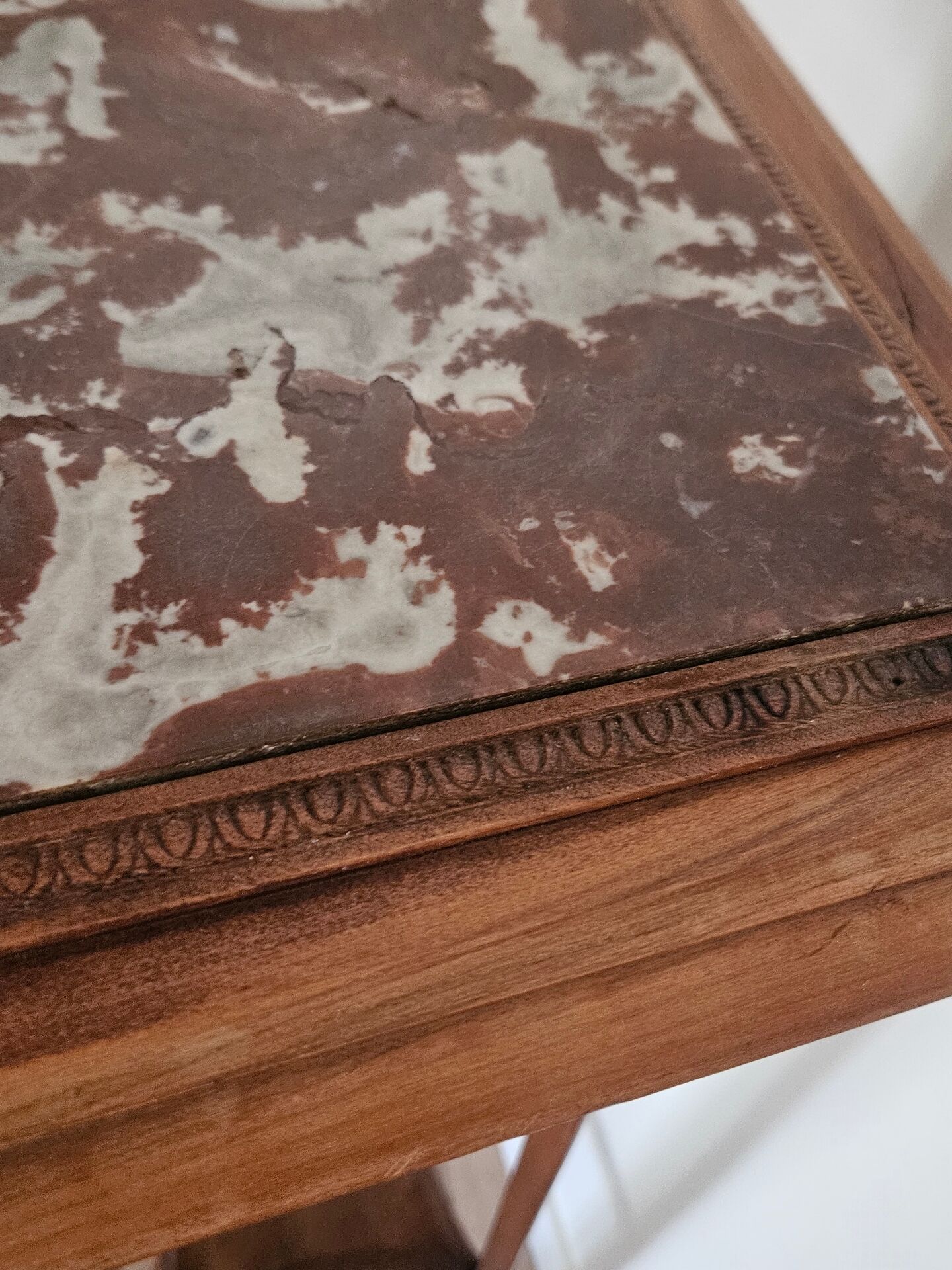 High plant stand in carved wood and Art Nouveau marble.
