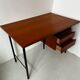 Vintage wooden and metal desk in modernist style.