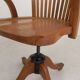 Oak office chair with adjustable spring system and height adjustment, 1950s.