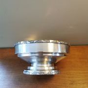 Art Deco coupe on a silver-plated metal stand.