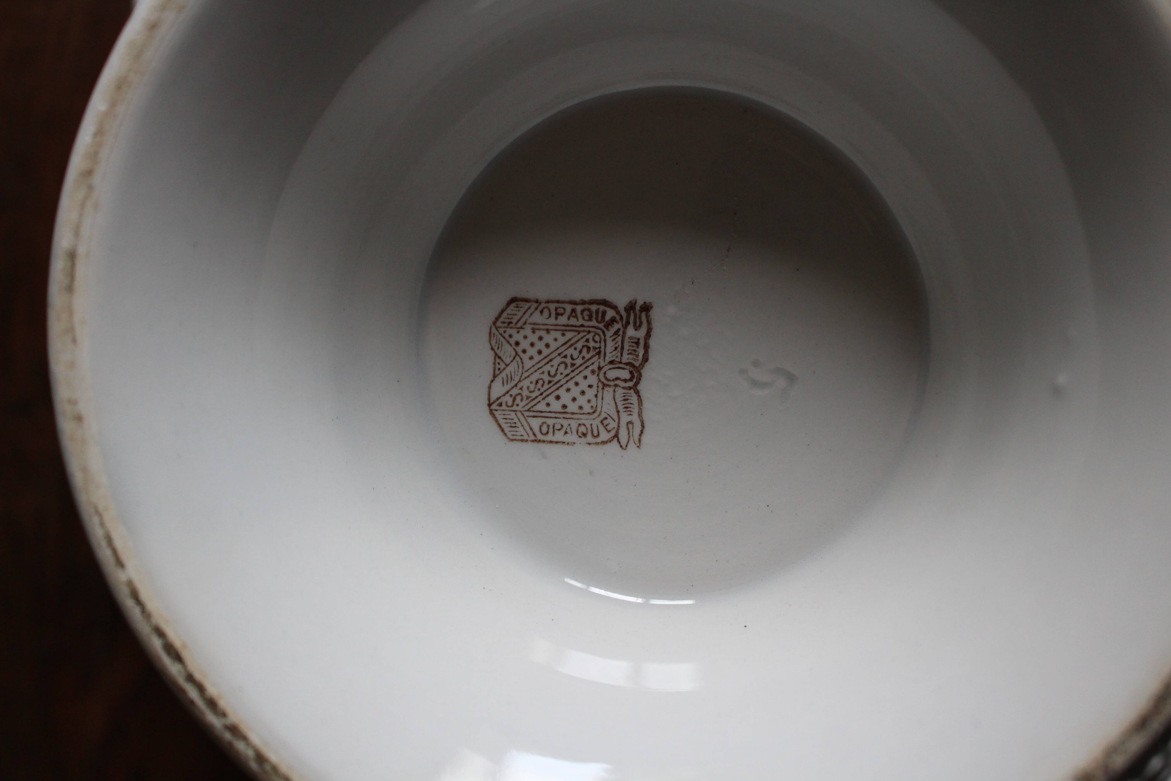 Antique soup tureen, white earthenware, with stopper decoration.