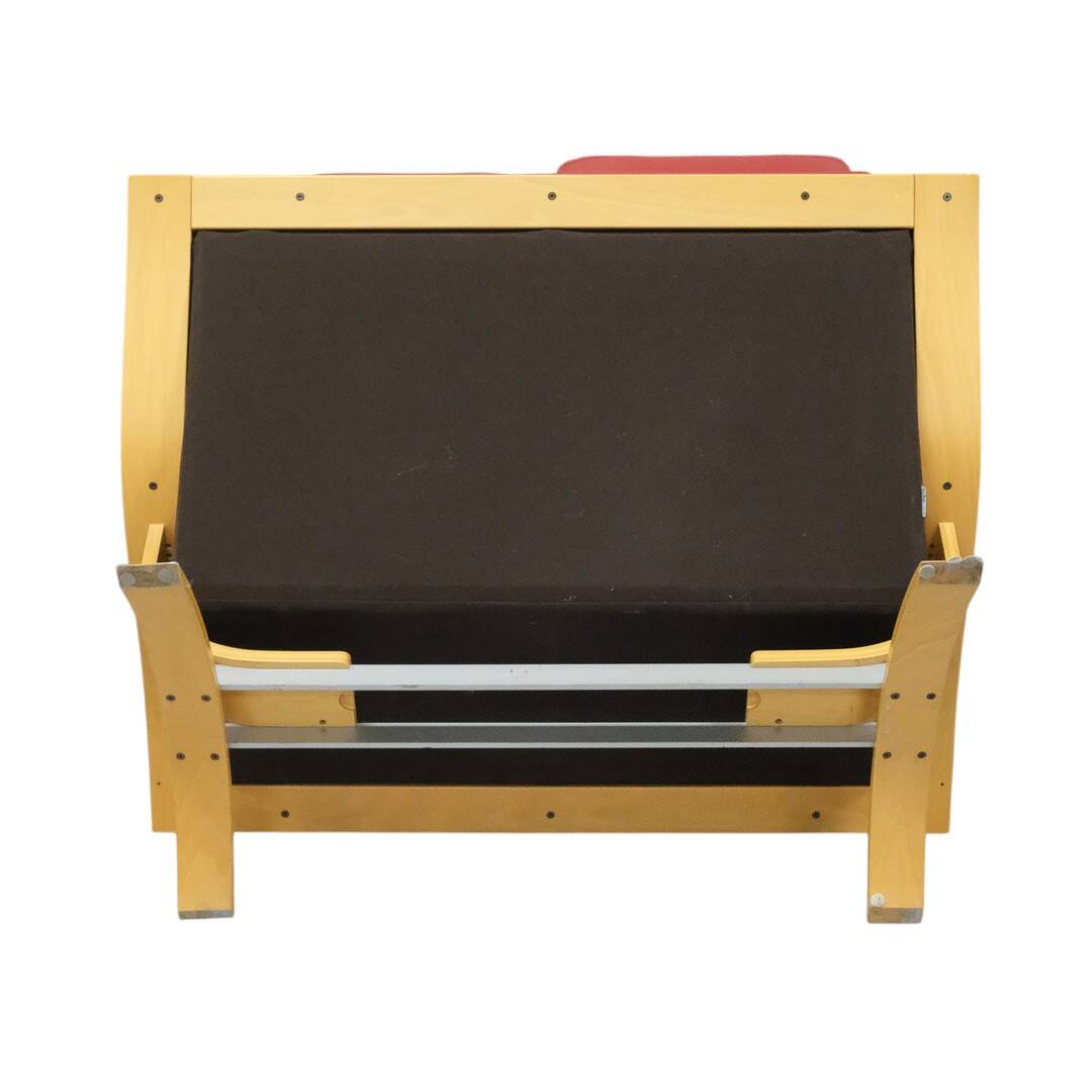 Two-seater red leather sofa by Roche Bobois on a bent beech base, France.