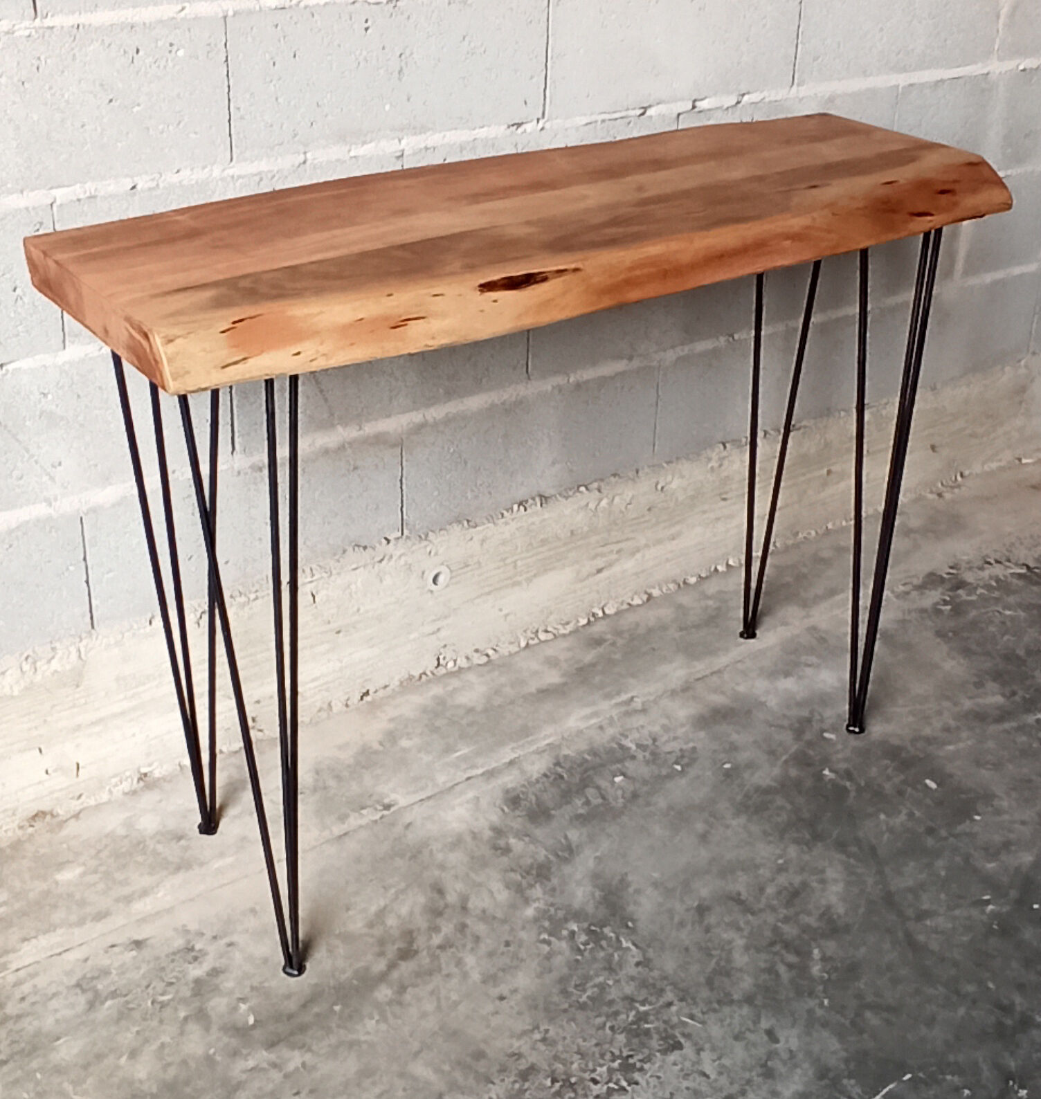 Wooden console with metal feet
