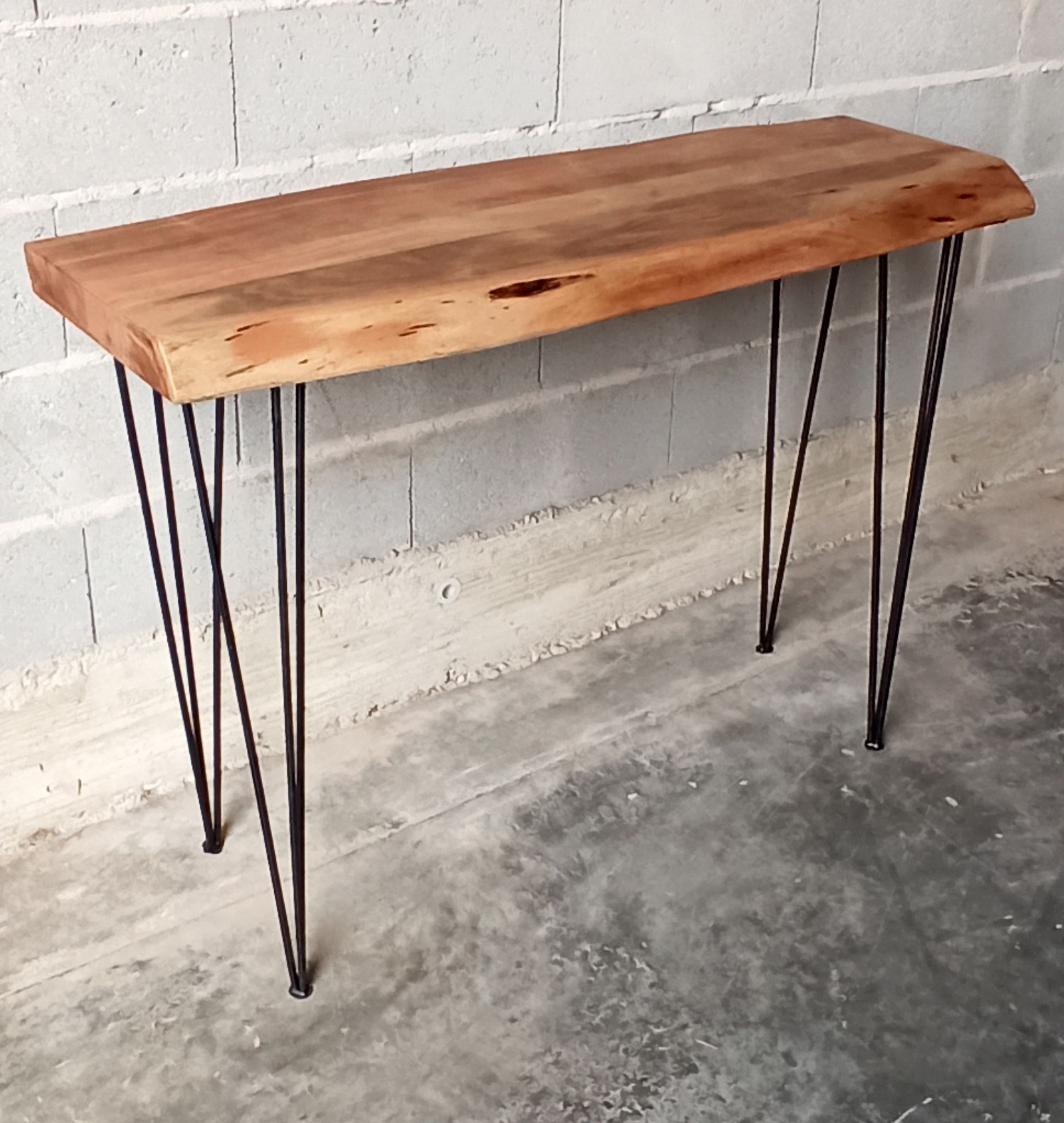 Wooden console with metal feet