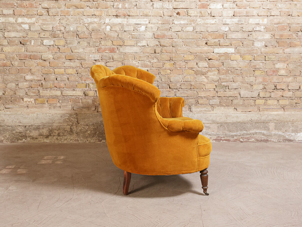 Yellow velvet padded toad sofa and wooden feet