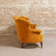 Yellow velvet padded toad sofa and wooden feet