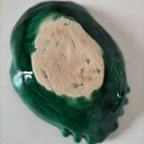 Vintage green slipware bowl in the shape of a cabbage leaf.