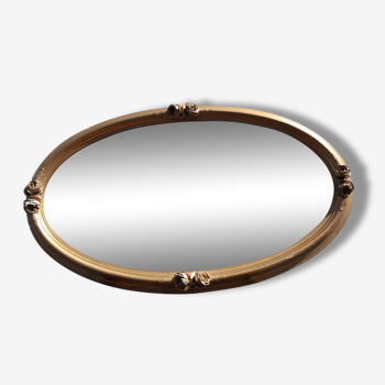 Miroir ovale biseauté et doré