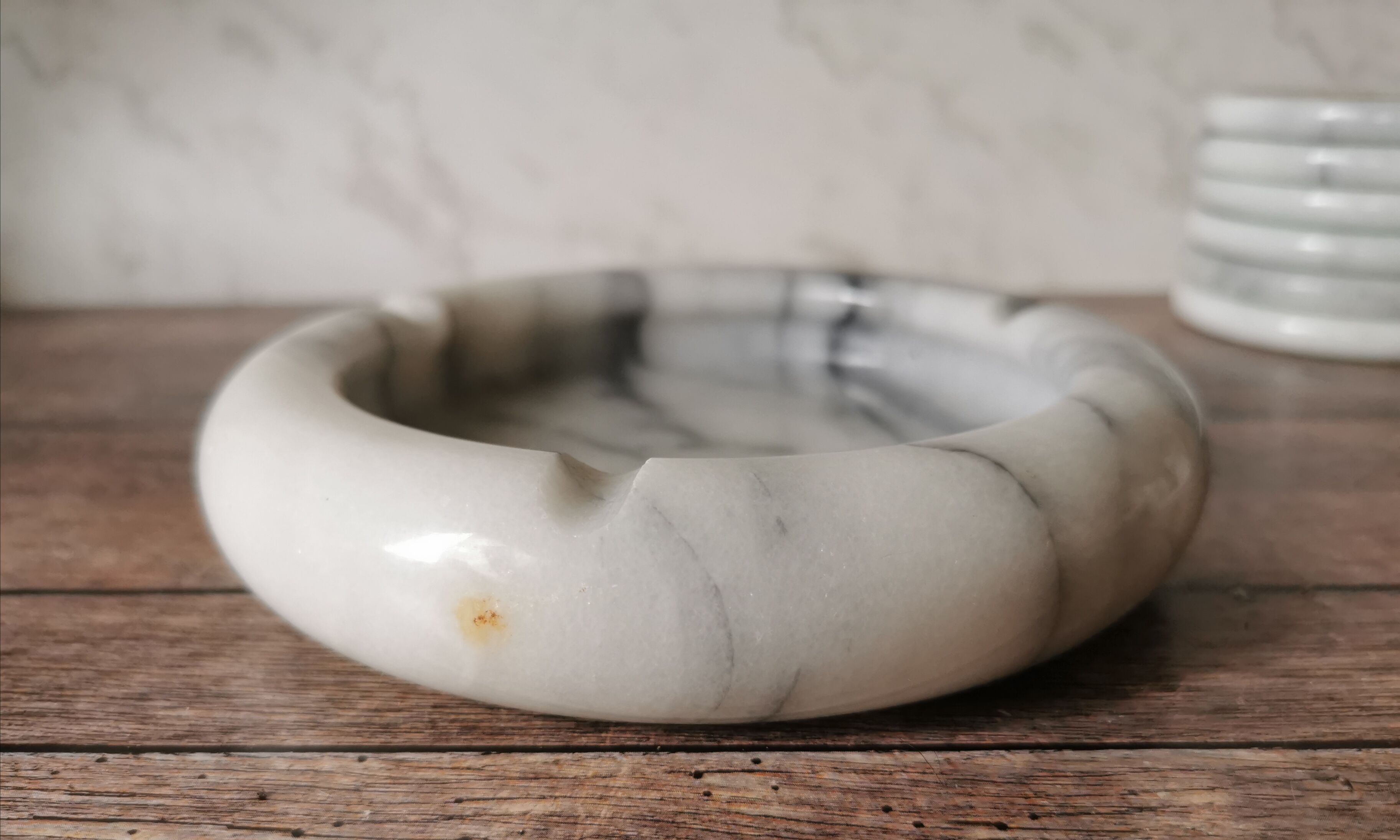 Ashtray and marble under glass