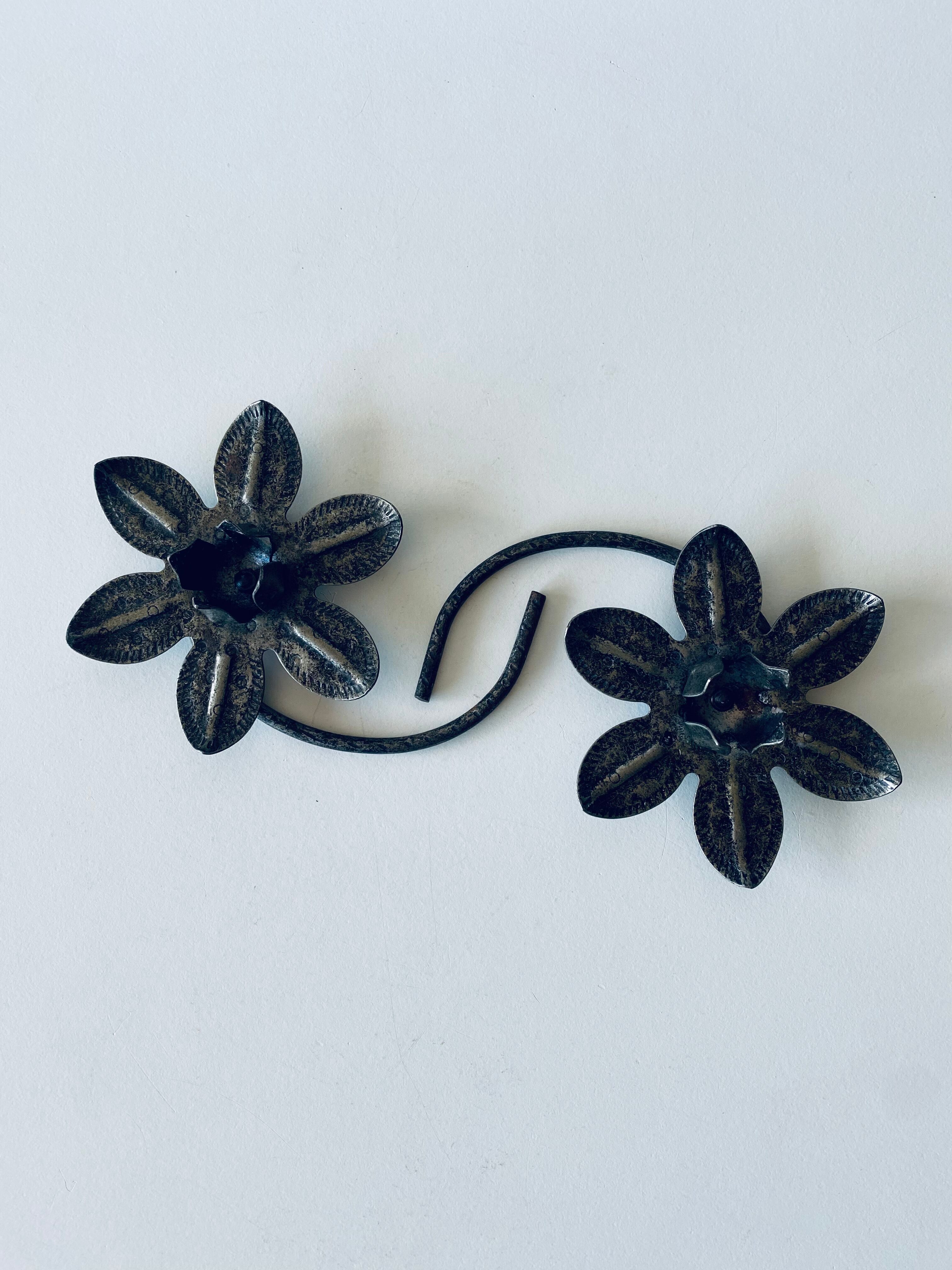 Pair of iron water lily candle holders
