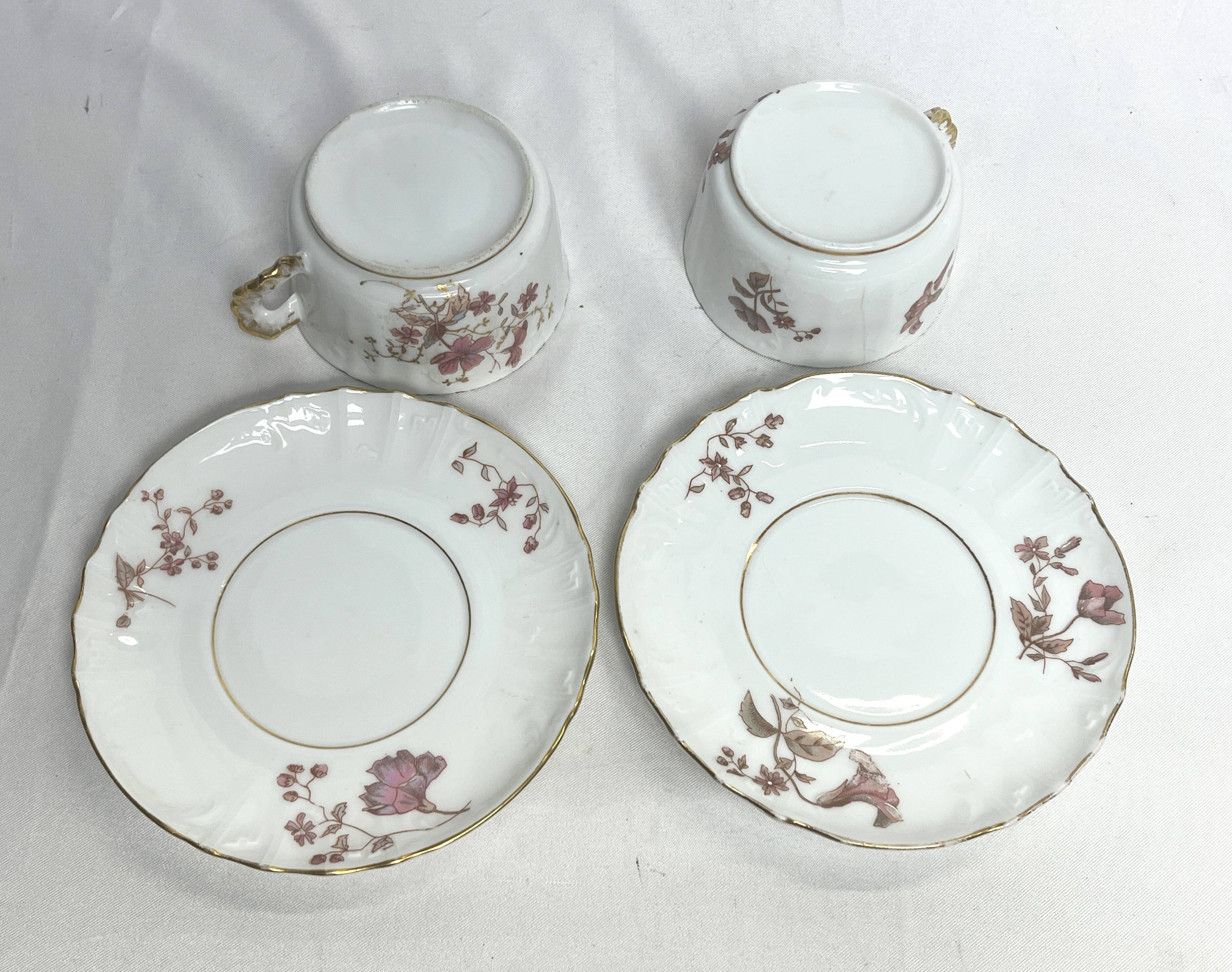 Two English porcelain teacups with floral decoration, 19th century