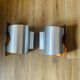 Pair of Space Age wall lights in brushed metal with a copper-orange interior.