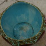 Old earthenware cachepot with flower decoration