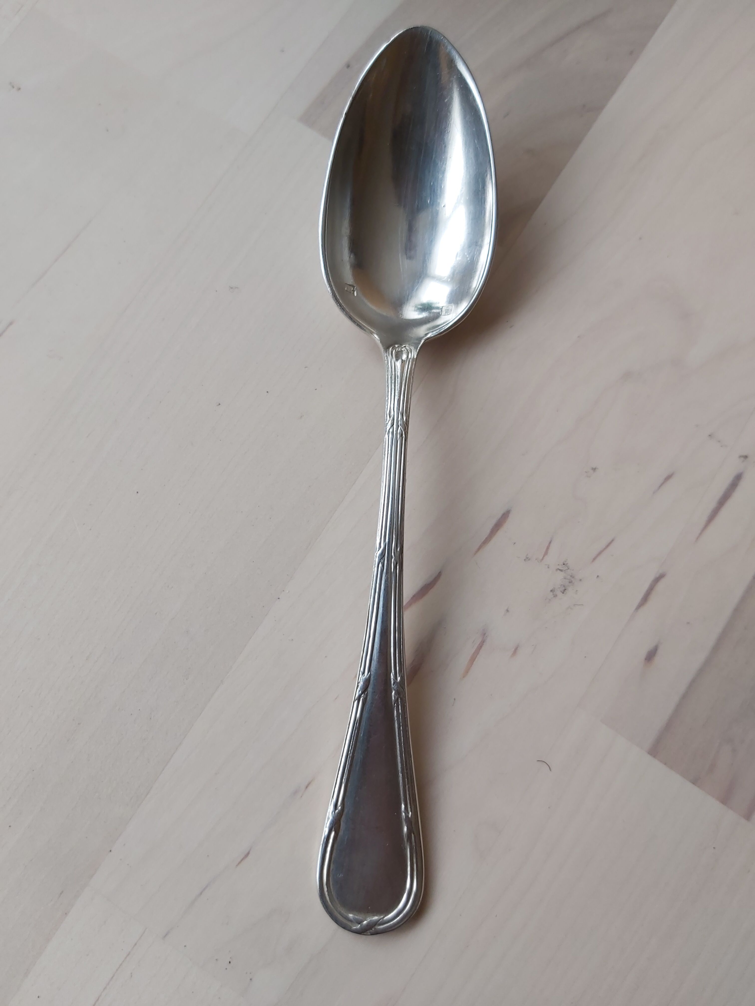 Series of 11 small silver metal spoons