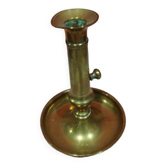 Old adjustable brass candle holder with pusher and bowl