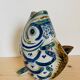 Blue ceramic zoomorphic vase in the shape of a poison.