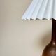Stone lamp with pleated shade