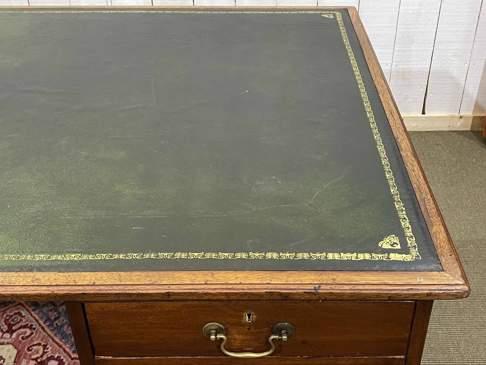 Large English flat desk in mahogany with leather top, early 20th century