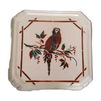 Ceramic dish mat with parrot decoration