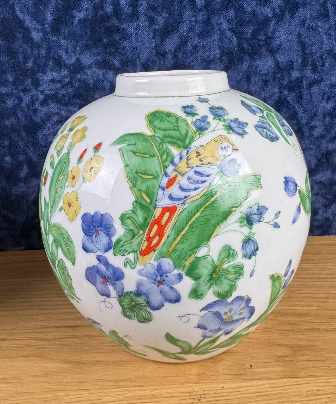 China circa 1900: pair of porcelain ball vases with birds and flowers