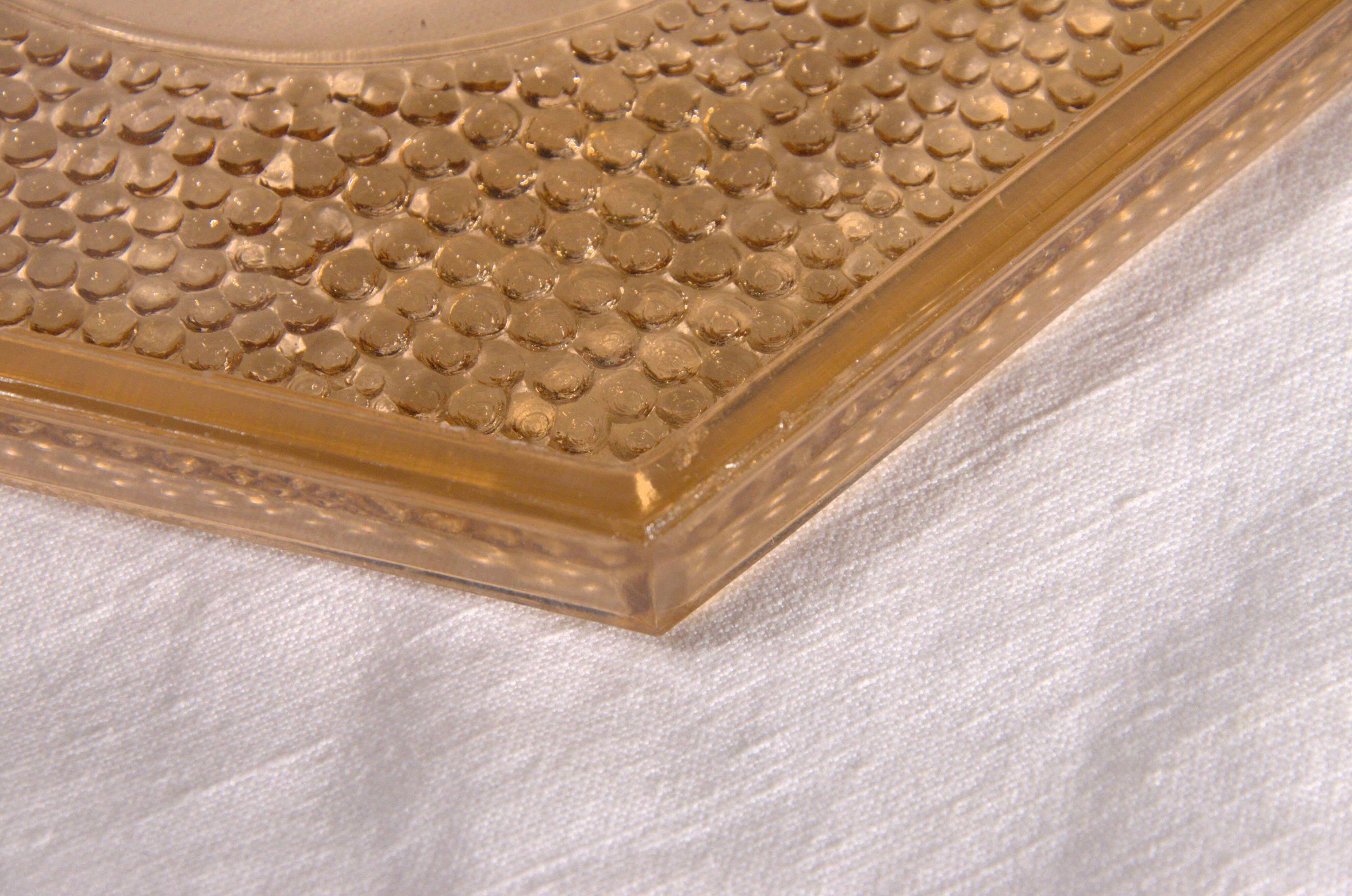 Art Deco hexagonal plate in pressed rose-orange glass, 27cm