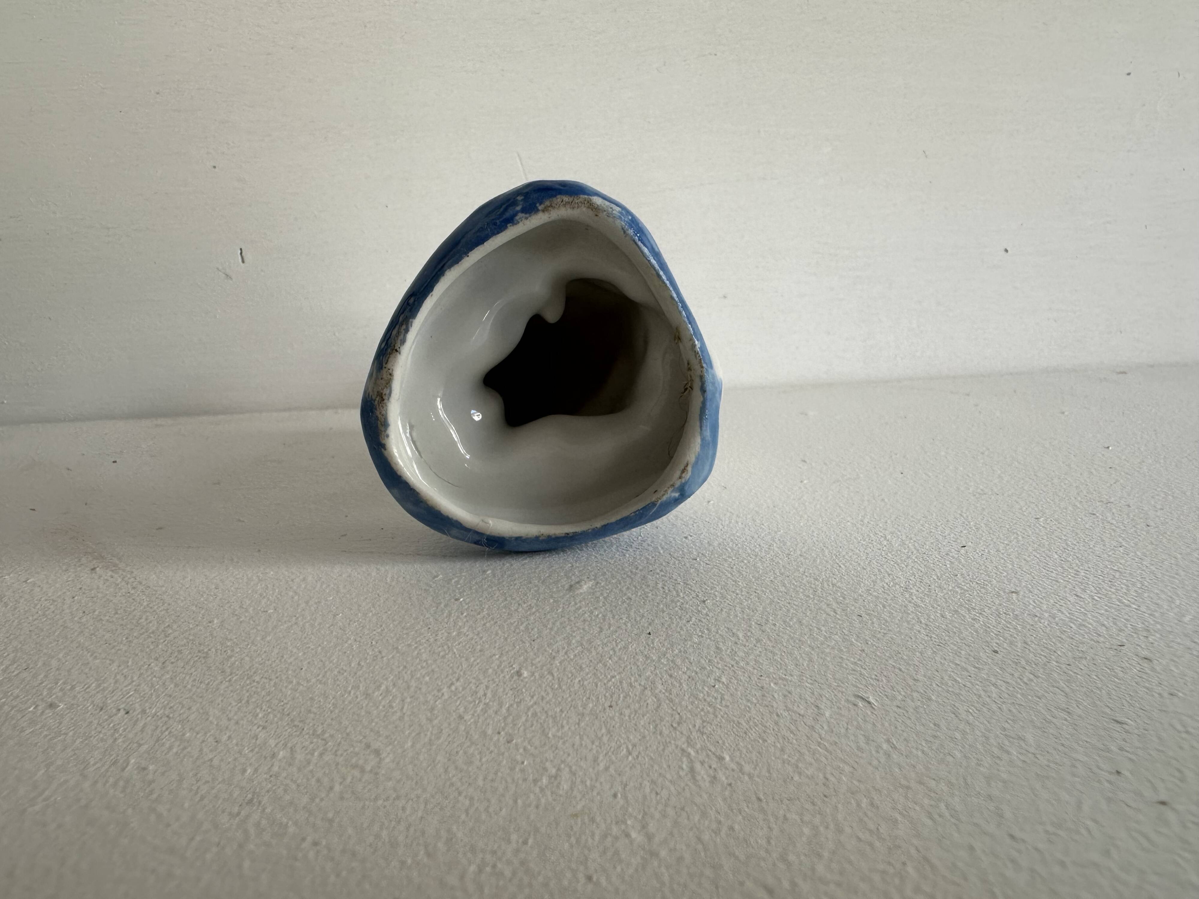 Small ancient glazed ceramic cat from the 19th century.