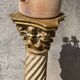 Wooden column in Corinthian style with gilding.