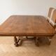 Antique extendable dining table made of solid wood.