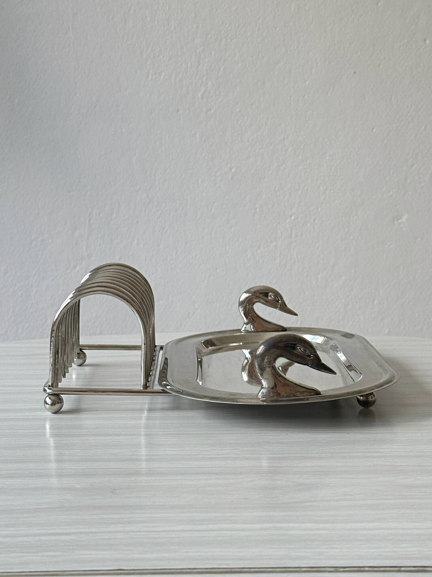 Ancient metal plateau with swans