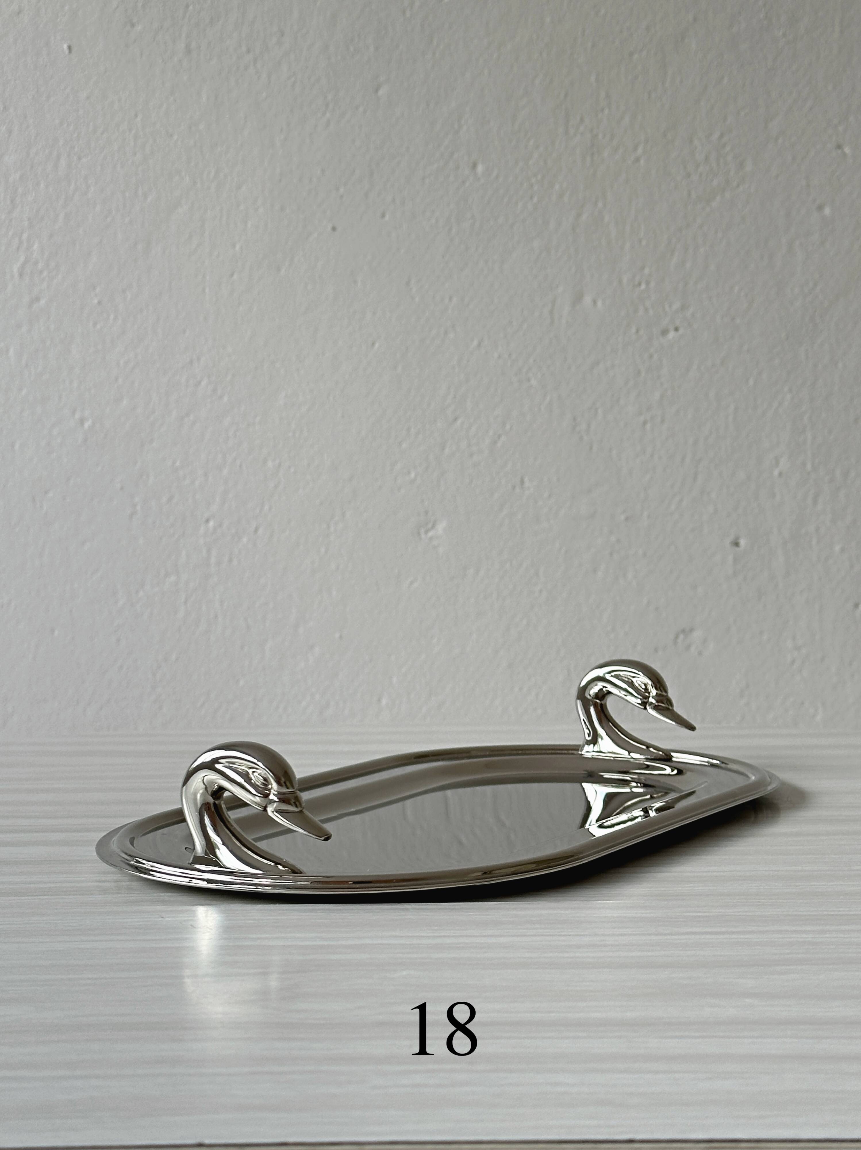Metal dish with goose head handles serving tray