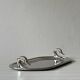Metal dish with goose head handles serving tray