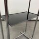 Bauhaus side table with a black glass top