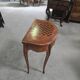 Half-moon gaming table in Louis XV style, made of precious wood marquetry.