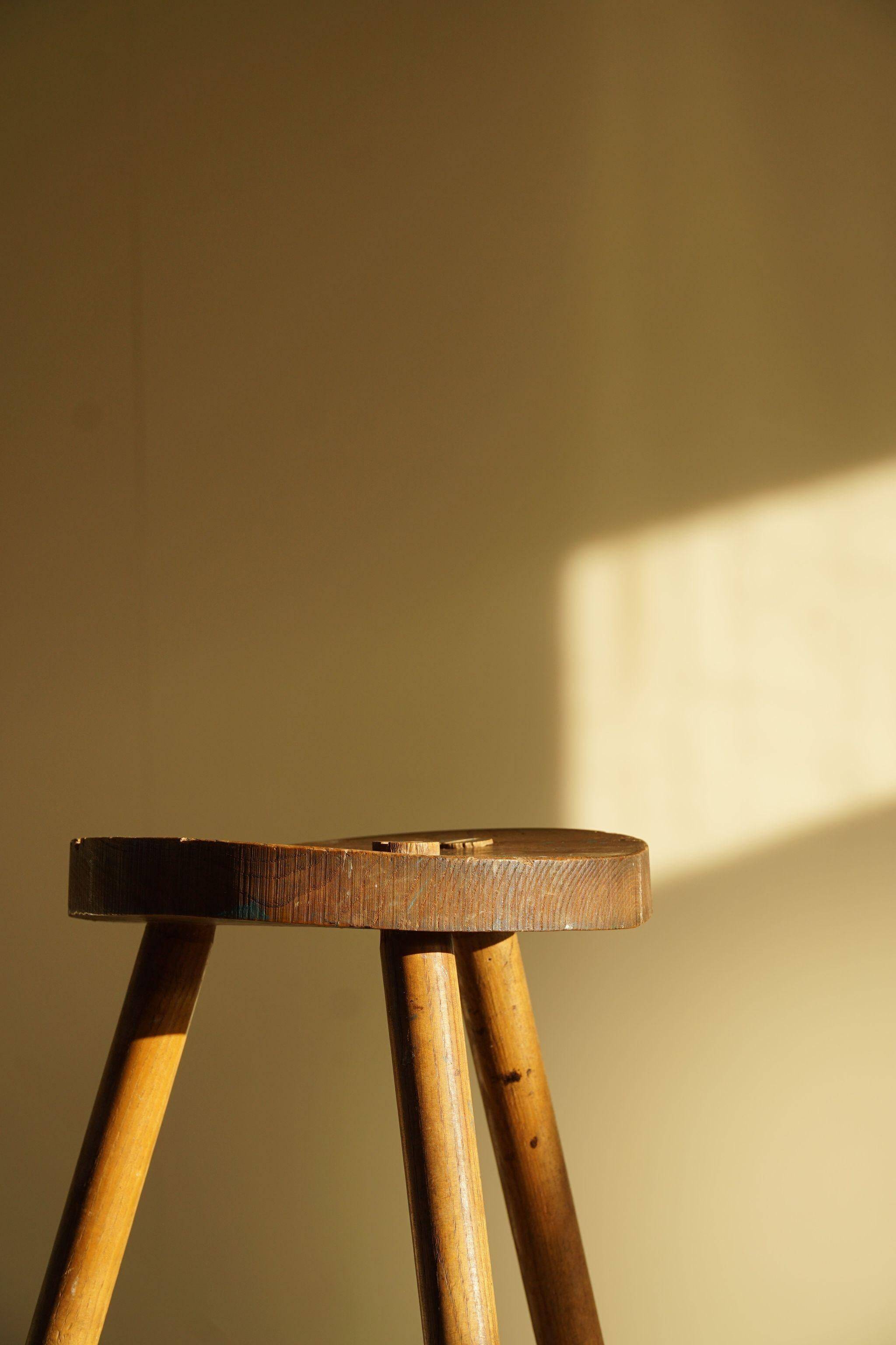 Tripod stool made of solid oak, by a Danish cabinetmaker, mid-century, around 1960.