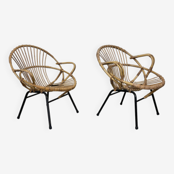 Pair of rattan armchairs with black steel base