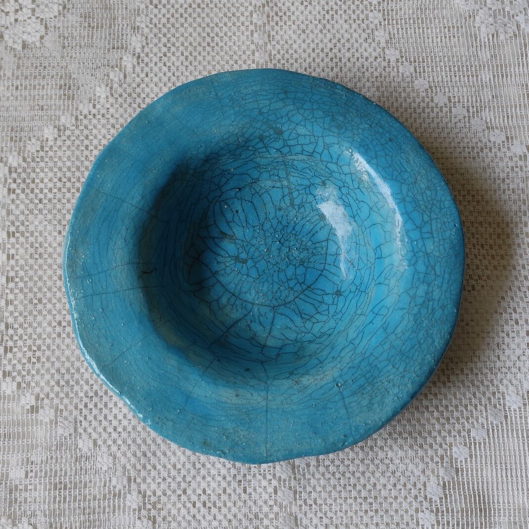 Empty turquoise raku pocket