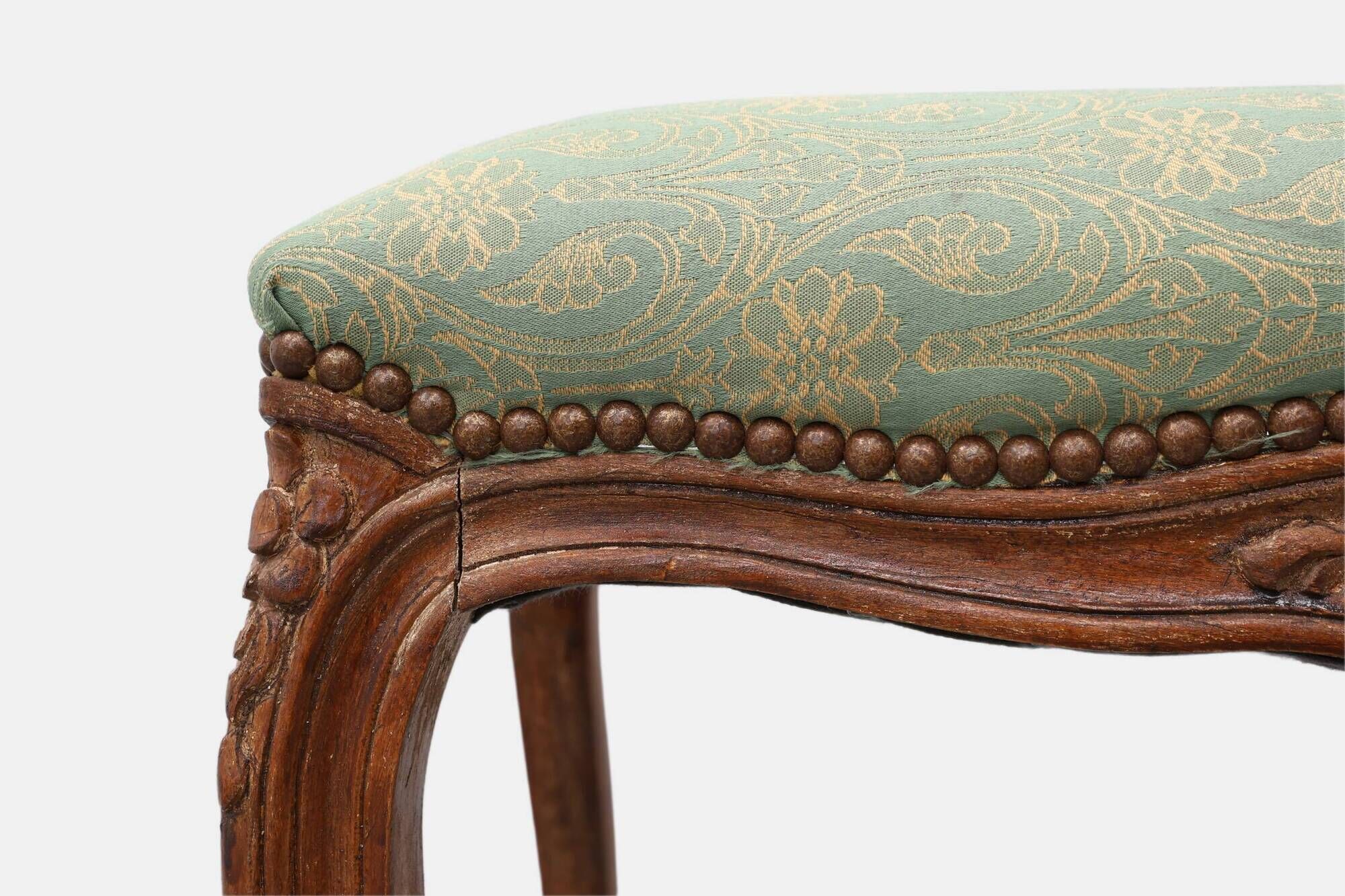 Louis XV stool with carved floral apron and original damask upholstery